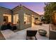 Spacious backyard patio area with lounge chair, tranquil fountain, and easy access to the home's interior at 7979 E Princess Dr # 26, Scottsdale, AZ 85255