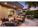 Inviting covered patio featuring comfortable seating, outdoor kitchen, and seamless access to indoor spaces at 7979 E Princess Dr # 26, Scottsdale, AZ 85255