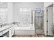 This bathroom has dual sinks, a soaking tub, and a glass-door shower at 8235 E Sierra Pinta Dr, Scottsdale, AZ 85255