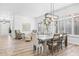 Spacious dining area with natural lighting, hardwood floors, and stylish furniture at 8235 E Sierra Pinta Dr, Scottsdale, AZ 85255
