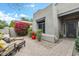 Inviting front yard featuring cozy outdoor seating and mature bougainvillea at 8235 E Sierra Pinta Dr, Scottsdale, AZ 85255
