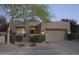 Charming single-story home featuring a well-manicured desert landscape and a two-car garage at 8235 E Sierra Pinta Dr, Scottsdale, AZ 85255