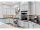 Modern kitchen featuring stainless steel appliances and ample white cabinet space at 8235 E Sierra Pinta Dr, Scottsdale, AZ 85255