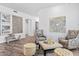 Cozy living room with hardwood floors, tasteful decor, and ample natural light at 8235 E Sierra Pinta Dr, Scottsdale, AZ 85255