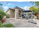 Comfortable outdoor living area featuring flagstone patio, furniture, and patio umbrellas for shade and comfort at 8235 E Sierra Pinta Dr, Scottsdale, AZ 85255