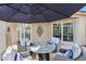 Elegant patio with outdoor seating, including a fire table and comfortable chairs at 8235 E Sierra Pinta Dr, Scottsdale, AZ 85255