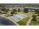 Aerial view of a community basketball court featuring dual courts with painted lines and nearby parking at 945 N Pasadena -- # 84, Mesa, AZ 85201