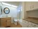 Bright bathroom featuring cabinets for storage, a tiled shower-tub combination, and a wood vanity at 945 N Pasadena -- # 84, Mesa, AZ 85201