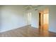 Spacious bedroom features neutral paint, wood-look floors, and an open doorway to a walk-in closet at 945 N Pasadena -- # 84, Mesa, AZ 85201