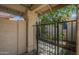 Gated courtyard entryway with desert landscaping and a walkway leading to the front door at 945 N Pasadena -- # 84, Mesa, AZ 85201