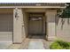 Charming covered front entrance with desert landscaping and the home address clearly displayed at 945 N Pasadena -- # 84, Mesa, AZ 85201