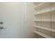 Entryway with a door to the outside, built-in shelving, and wood-look flooring at 945 N Pasadena -- # 84, Mesa, AZ 85201