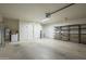 Functional garage featuring storage shelving, water heater, and convenient access to household utilities at 945 N Pasadena -- # 84, Mesa, AZ 85201