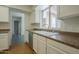 Cozy eat-in kitchen with countertop, modern appliances, and sink window at 945 N Pasadena -- # 84, Mesa, AZ 85201
