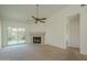 Bright living room with a fireplace and sliding glass doors to the backyard at 945 N Pasadena -- # 84, Mesa, AZ 85201