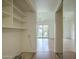 Bright living room with sliding glass doors leading to landscaped backyard, showcasing neutral paint and wood-look flooring at 945 N Pasadena -- # 84, Mesa, AZ 85201