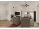 Bright living room featuring tile floors, high ceilings, and an open floor plan at 10208 W Highland Ave, Phoenix, AZ 85037