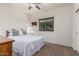 Cozy bedroom with queen bed, side table, and natural light from window with blinds at 1322 W Spur Dr, Phoenix, AZ 85085