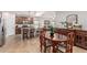 Open concept eat-in kitchen and dining area with stainless steel appliances and wooden table set at 1322 W Spur Dr, Phoenix, AZ 85085