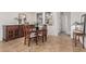 Elegant dining room featuring tile floors, a dark wood table set, and built-in buffet cabinet at 1322 W Spur Dr, Phoenix, AZ 85085