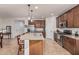 Spacious kitchen featuring granite countertops, stainless steel appliances, and a large island with seating at 1322 W Spur Dr, Phoenix, AZ 85085