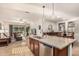 Spacious kitchen island with granite countertop and stainless steel appliances opening into the Gathering room at 1322 W Spur Dr, Phoenix, AZ 85085