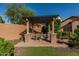 Backyard pergola with outdoor seating area featuring a beautiful turf yard and privacy fence at 1322 W Spur Dr, Phoenix, AZ 85085