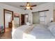 Bright bedroom featuring a wooden bed frame and a sliding barn door to the closet at 2017 E Willis Rd, Gilbert, AZ 85297