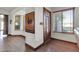 Inviting foyer featuring a wood door, adjacent windows, and wood-look flooring at 2017 E Willis Rd, Gilbert, AZ 85297