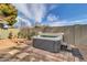 This private backyard includes a hot tub with brick accents and easy access at 2017 E Willis Rd, Gilbert, AZ 85297