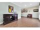 A large living room with tile floors, beadboard and natural light from the entry door at 2017 E Willis Rd, Gilbert, AZ 85297
