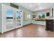 Inviting living room featuring bright light, a window seat and glass doors to the outside at 2017 E Willis Rd, Gilbert, AZ 85297