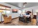 This main bedroom offers natural light, a ceiling fan, and beautiful wood furniture at 2017 E Willis Rd, Gilbert, AZ 85297