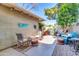 Cozy outdoor patio with bistro lighting, stylish furniture, and a charming, intimate setting at 2017 E Willis Rd, Gilbert, AZ 85297