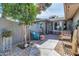 Inviting patio area featuring stylish decor, comfortable seating, and lush landscaping at 2017 E Willis Rd, Gilbert, AZ 85297