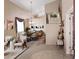Open-concept dining room with vaulted ceilings, elegant chandelier, and seating for at least six guests at 2408 W Crimson Ter, Phoenix, AZ 85085