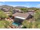 Expansive aerial view showcasing a home with a private pool in a tranquil neighborhood with picturesque desert landscape at 3060 N Ridgecrest -- # 200, Mesa, AZ 85207