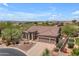 Expansive aerial view of home with a desert landscape, private driveway, and beautiful mountain views at 3060 N Ridgecrest -- # 200, Mesa, AZ 85207