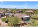 The private backyard features a pool, patio, desert landscape, and luxurious outdoor living space at 3060 N Ridgecrest -- # 200, Mesa, AZ 85207