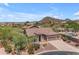 An aerial shot showcasing the home's desert landscaping, private pool, and mountain views at 3060 N Ridgecrest -- # 200, Mesa, AZ 85207