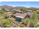 Stunning aerial view of a home featuring a refreshing pool and mountain views, perfect for relaxed outdoor living at 3060 N Ridgecrest -- # 200, Mesa, AZ 85207