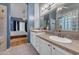 Clean and spacious bathroom with double sinks and view into the bedroom space at 3060 N Ridgecrest -- # 200, Mesa, AZ 85207