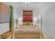 Bright bedroom features neutral walls, a patterned bedspread, bedside lamps, and a closet at 3060 N Ridgecrest -- # 200, Mesa, AZ 85207