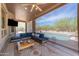 Relaxing covered patio with views of the beautiful pool and desert landscape at 3060 N Ridgecrest -- # 200, Mesa, AZ 85207