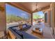 Inviting covered patio with comfortable seating, overlooking the backyard pool area at 3060 N Ridgecrest -- # 200, Mesa, AZ 85207