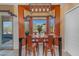 Stylish dining area with a wooden table and chairs, accented by a modern light fixture at 3060 N Ridgecrest -- # 200, Mesa, AZ 85207