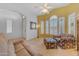 Inviting living room with large windows and stylish furnishings, creating a comfortable and bright living space at 3060 N Ridgecrest -- # 200, Mesa, AZ 85207