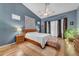 Bright main bedroom with stylish decor, vaulted ceiling, bay window, and cozy furnishings at 3060 N Ridgecrest -- # 200, Mesa, AZ 85207