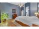Spacious main bedroom features ensuite bathroom access, stylish decor, and plenty of natural light at 3060 N Ridgecrest -- # 200, Mesa, AZ 85207
