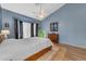 Serene main bedroom boasts a vaulted ceiling, bay window, and a comfortable king-sized bed at 3060 N Ridgecrest -- # 200, Mesa, AZ 85207